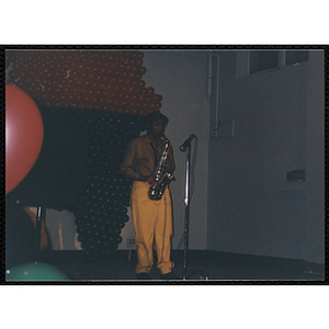 A man plays a saxophone during a Black History celebration