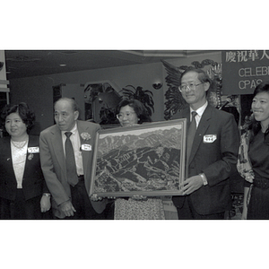 You King Yee, Suzanne Lee, other guests, and artwork at Chinese Progressive Association's 15th Anniversary Celebration