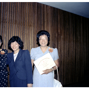 Commencement speaker and graduates after Roxbury Community College's commencement ceremony