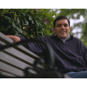 Co-op student sitting on bench on the Northeastern's Boston campus