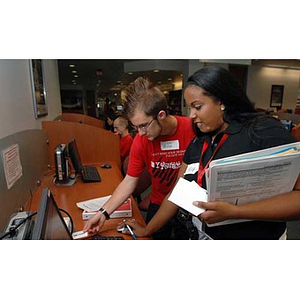 Jordan Munson and Ana Hidalgo work on a computer during the Torch Scholars Scavenger Hunt