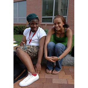 Ulysses Ifill and Melanie Arvajo smile during a scavenger hunt