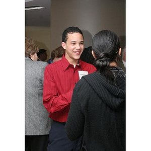 Odalis David Polanco converses with others at a Torch Scholars event