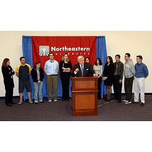 U.S. Senator Edward Kennedy (D-MA) speaks at the podium surrounded by students during a press conference on student aid