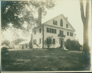 Portrait of Kate Douglas Wiggin, sitting on the front steps of her home, facing front, Hollis, Maine, undated