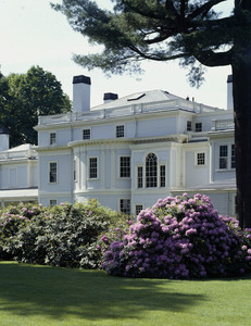 Exterior view of rear facade with rhododendron, Lyman Estate, Waltham, Mass.
