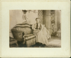 Informal portrait of Jane Tucker, sitting on a sofa, Piazza, Castle Tucker, Wiscasset, Maine, undated