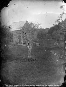 Unidentified landscape of trees, barn and surrounding land