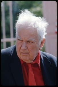 Alexander Calder: bust portrait in a red tie