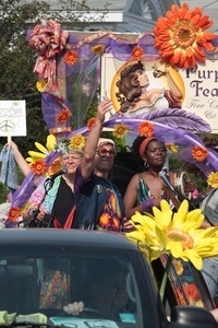 Purple Feather chocolate shop float in the parade : Provincetown Carnival parade