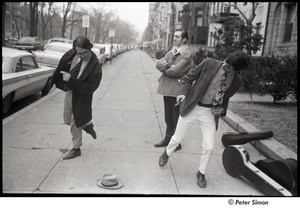 George Nelson, Neil Rossi, and David Doubilet dancing in the street