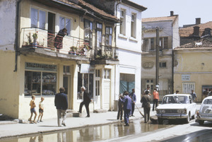 Woman watching street cleaning