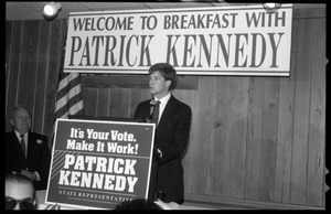 Patrick Kennedy campaign breakfast of ham and eggs at Caruso's Restaurant: Kennedy speaking at the podium beneath a sign reading 'Welcome to breakfast with Patrick Kennedy'