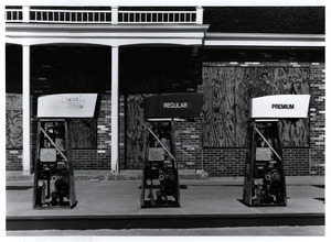 Gas pumps at boarded up station