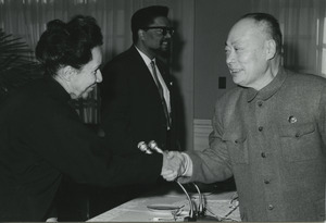 Shirley Graham Du Bois shaking hands with Chen Yi
