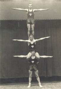Three Gymnasts Balancing on Each Other