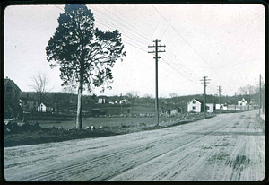 Vine Street to Left by stone wall, Main Street