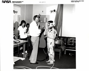 Payload Specialist Christa McAuliffe Briefed on Launch/Entry Helmets