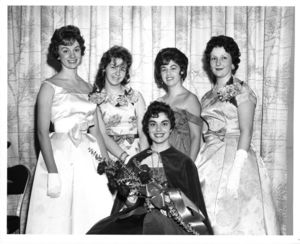 Suffolk University Queen Sylvia Katsenes and her court (Maggie Donovan, Paula Brown, Miriam Straus, and Nancy Hewitt) at a Suffolk University dance, 1961