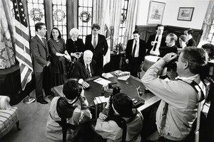 O'Neill reception: Tip O'Neill in a replica of his speaker's office, with family and friends looking on