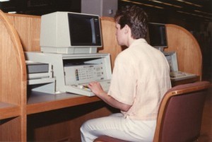 O'Neill Library interior: student using computer with Infotrac