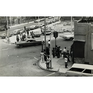 Hispanic American youths stand at the intersection of Mt. Pleasant Avenue and Blue Hill Avenue, opposite La Alianza Hispana headquarters, Roxbury, Mass., after attending a youth services program.
