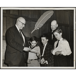 Three boys receiving awards in the Boys' Clubs of Boston Essay Contest