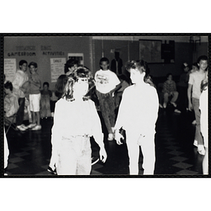 Group of people standing around in the games room