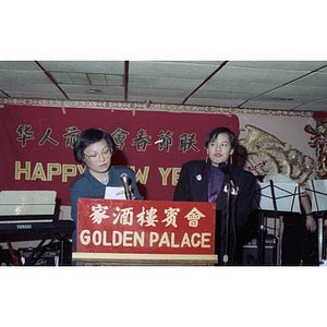 Two women speak at a gathering of the Chinese Progressive Association to celebrate the Chinese New Year