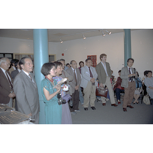 Members of the Chinese Progressive Association and others are gathered at a welcome party held for the visiting Consulate General of the People's Republic of China