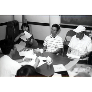 CPA members talking at a Workers' Center meeting