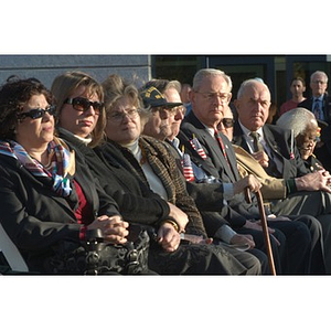 Several people in the audience at the Veterans Memorial dedication ceremony