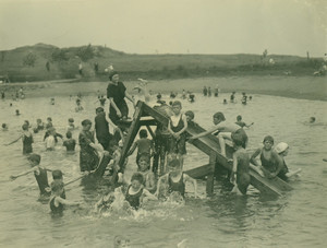 Boy campers on water slide