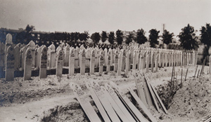 Rows of wooden boards marking graves of Algerian soldiers