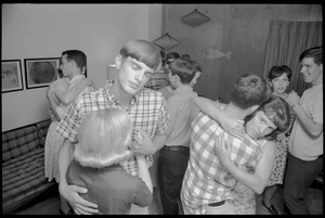 Teenage long hair: boys and girls slow-dancing at a teenage dance party