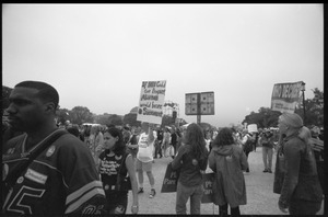 Marchers on the National Mall for the 2004 March for Women's Lives, one with a sign reading 'If men could get pregnant, abortion would be a sacrament'