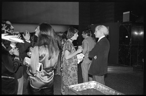 Andy Warhol mingling with attendees at a reception at the Birmingham Museum of Art