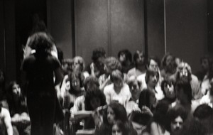 UMass Amherst students seated in a lecture hall (underexposed)