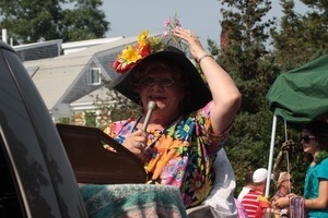 Parade marcher with a microphone : Provincetown Carnival parade