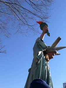 Woman dressed as the Statue of Liberty among the protesters on the National Mall, marching against the War in Iraq