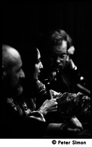 Unidentified man (foreground), Joan Baez, and David Harris: news conference following their wedding