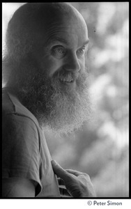 Ram Dass: half-length portrait in a tee-shirt while at the Rowe Center spiritual retreat