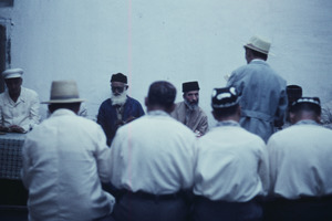 Men sitting at a long table