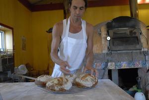 Hungry Ghost Bread: owner and baker Jonathan C. Stevens with fresh-baked bread