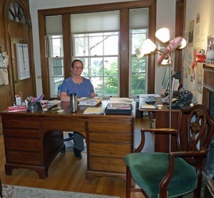 Jones Library: Sharon Sharry, Library Diretor, seated in the Director's office