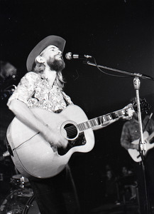 New Riders of the Purple Sage opening for the Grateful Dead at Sargent Gym, Boston University: John 'Marmaduke' Dawson playing acoustic guitar and signing