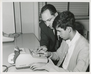 An instructor and trainee at TOWER clerical training