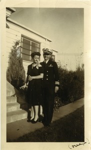 Commander Stanley W. Lipsiki in naval uniform and wife Sigrid Johnson Lipski outside a residence