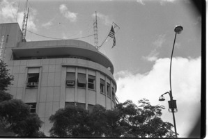 Embassy building showing flag and 5th floor offices of Taylor and Alexis Johnson; Saigon.