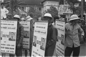 Hired pedicab drivers carrying political posters for Ky and Thieu.